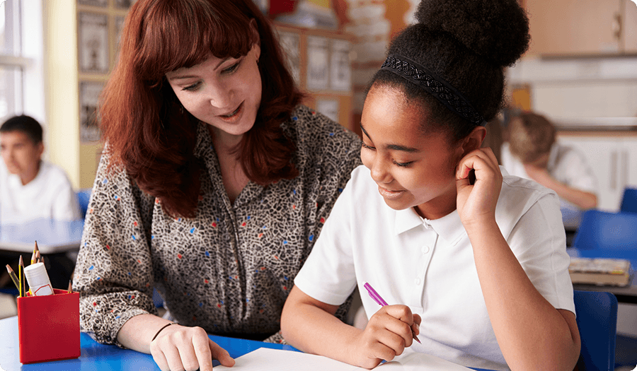 Teacher working with students in a classroom