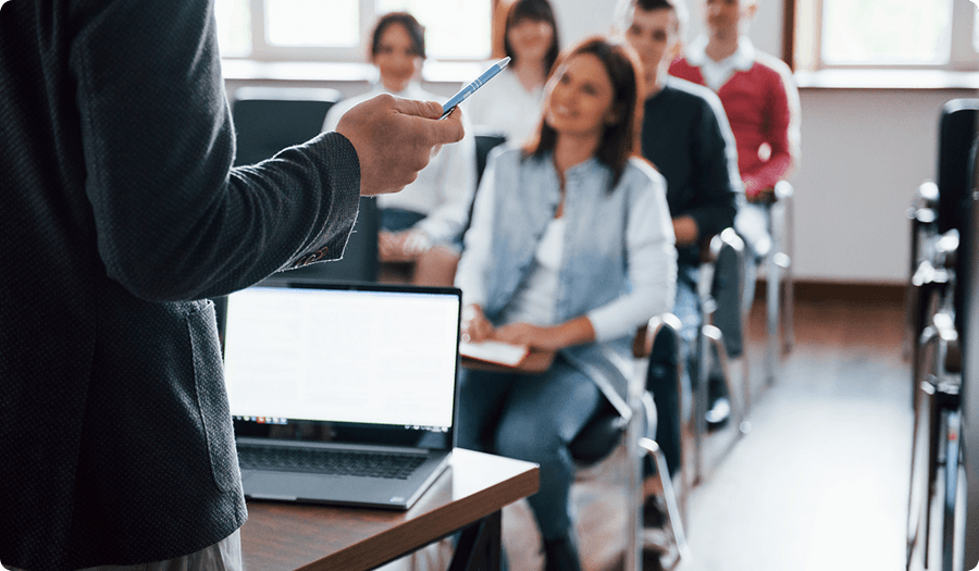 Trainer presenting to a group of professionals